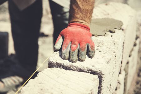 the hands of the constructor red gloves