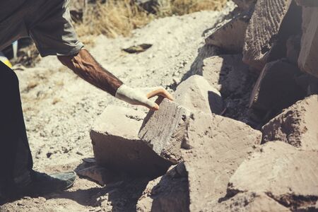 The man builder is building a wallの写真素材