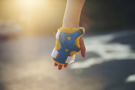 hand protective pads for a baby in natureの写真素材