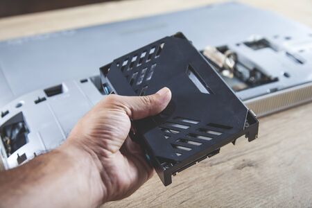 worker man repair computer on the deskの写真素材