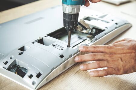 worker man repair computer on the deskの写真素材