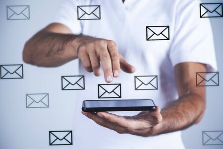 man hand smart phone with letter in screenの写真素材