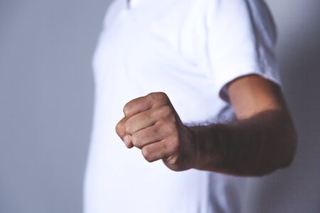 young business man fist on the gray background