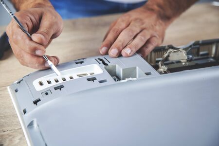young worker man repair computer on deskの写真素材