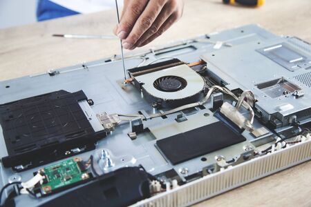 young worker man repair computer on desk