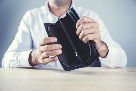 man hand empty wallet on table background