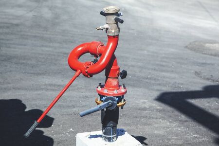 red fire hydrant on gray ground backgroundの写真素材