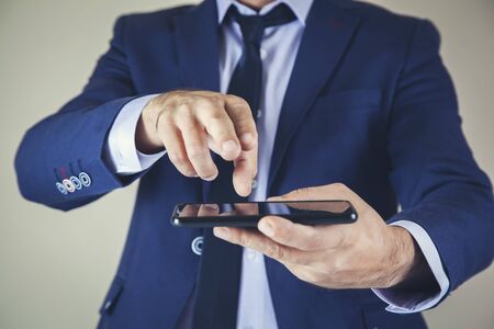 business man hand smart phone in screen