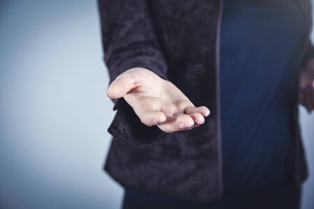 woman empty palm on the dark wall background