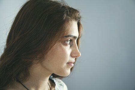 happy woman in the studio on gray backgroundの写真素材