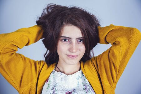 young beautiful woman hand holding long hairの写真素材