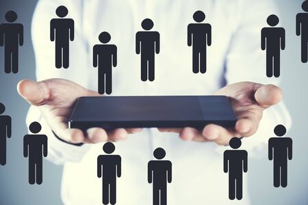 man hand tablet with team network  in screenの写真素材
