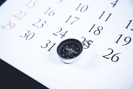 compass on the Calendar on the desk