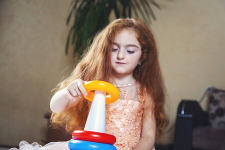 baby playing colorful and different games in homeの写真素材