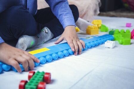 baby playing in toys in the homeの写真素材