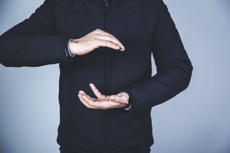 man empty hand on the gray backgroundの写真素材