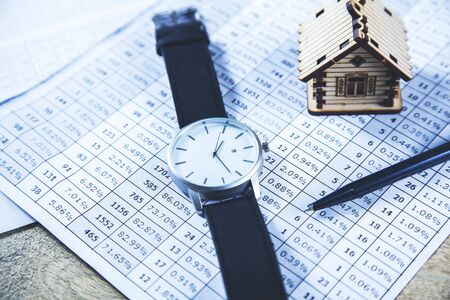 man elegant watch on graph on deskの写真素材