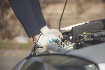 Hands auto mechanic in car repair service