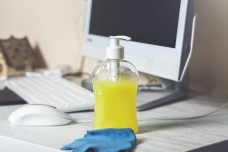 gel bottle using a hand wash and Alcohol 75% in a spray tube placed on the table