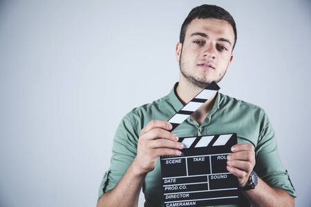 young business man hand movie sign in studioの写真素材