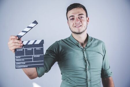 young business man hand movie sign in studioの写真素材