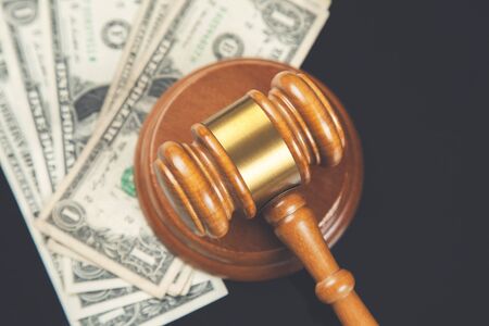 judge with money on the black table
