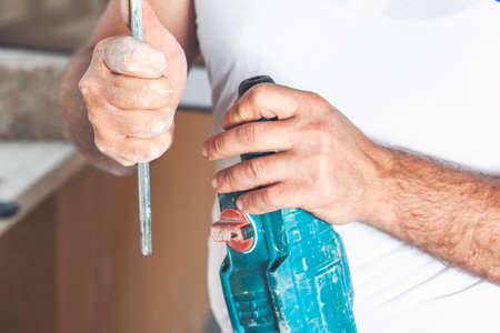 Hammer drill, installation of a chisel in a perforate.の写真素材