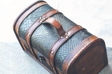 Brown wooden case on a gray stone backgroundの写真素材