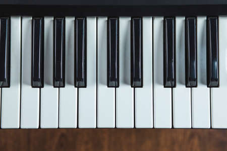 electronic piano keyboard keys closeup in black and whiteの写真素材