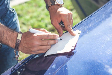 Male hand ready to draw with white marker
