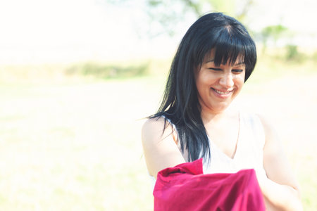 Portrait of a beautiful young smiling girlの写真素材