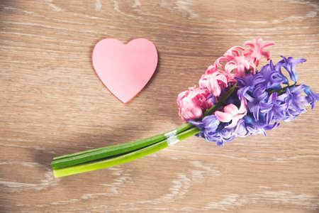 Festive holiday greeting card for Valentines, Birthday, Woman or Mothers Day. Pink paper heartsの写真素材