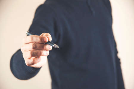 young man hand pen in the screenの写真素材