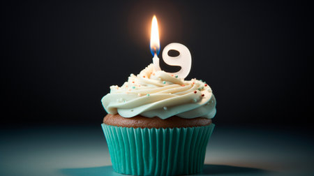 a cupcake with a candle on top of itの素材