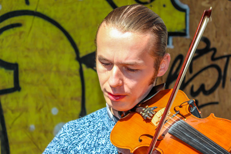 ISTANBUL, TURKEY - APRIL 3: A violin man on the street on April 3, 2015 in Istanbul