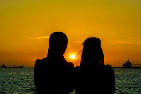 Girls at sunsetの写真素材