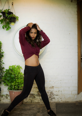 Hot flexible toned girl posing in the streetsの写真素材