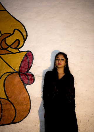 a beautiful classical dancer posing on a streetの写真素材
