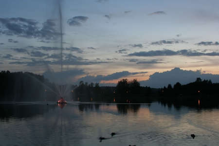 Night scene - a lake with a fountainの写真素材