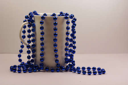 Blue decoration in white cup, isolatedの写真素材