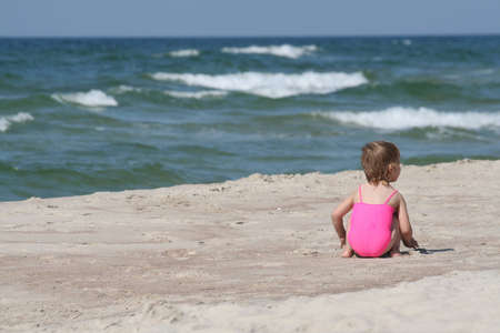 A little girl at the beachの写真素材