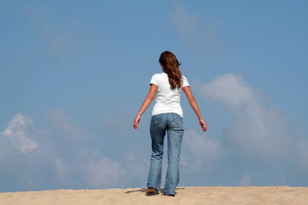 A woman going on the sandの写真素材