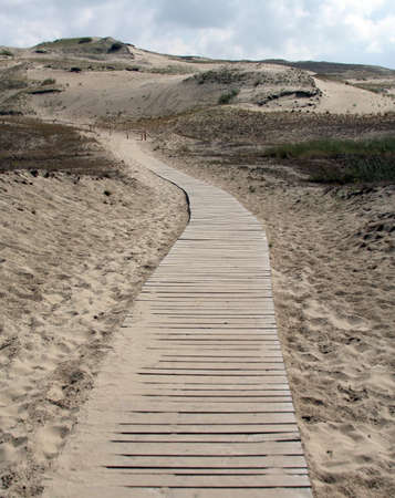 A road through sand dunes; Lithuaniaの写真素材