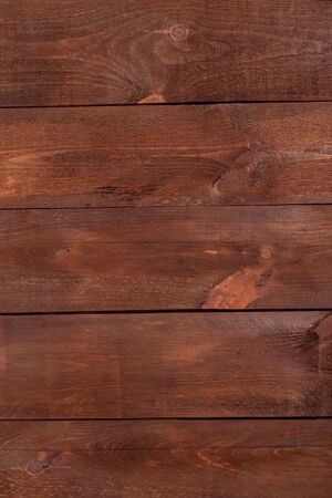 Natural brown wooden table with a rough texture. Can be used for floors, walls, ceilings and furniture.の写真素材