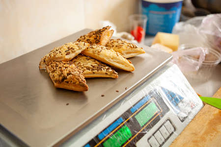 Baking with seeds, herbs on electronic scales. Natural lightの写真素材