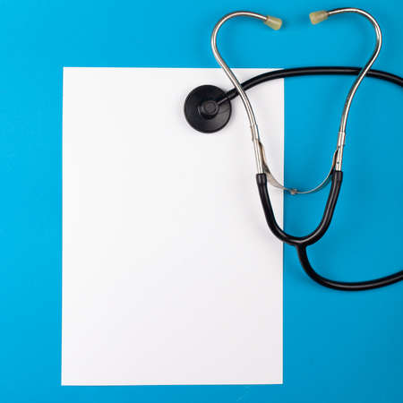 Mocup medicine on a blue background. phonendoscope, medical supplies. flat lay empty white space for...