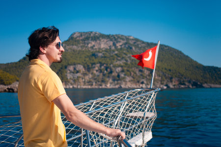 a yacht glides through the azure waters of the Mediterranean Sea, exploring Turkey's coastal beautyの写真素材