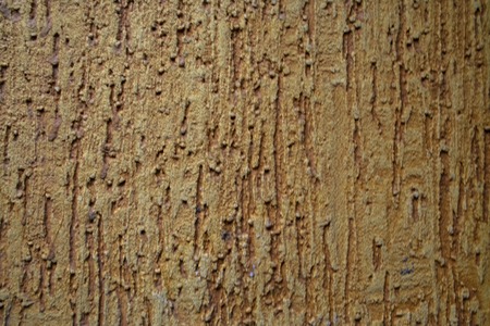 decorative stone texture coloured into ocher, wallpaperの写真素材