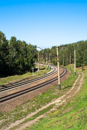 railroad with a turn in a summer dayの写真素材