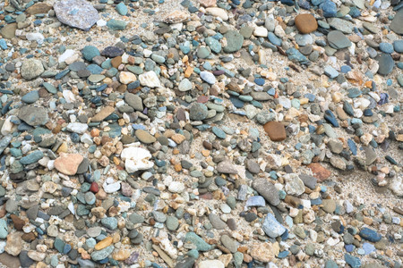 colorful pebble at the sand abstract textureの写真素材